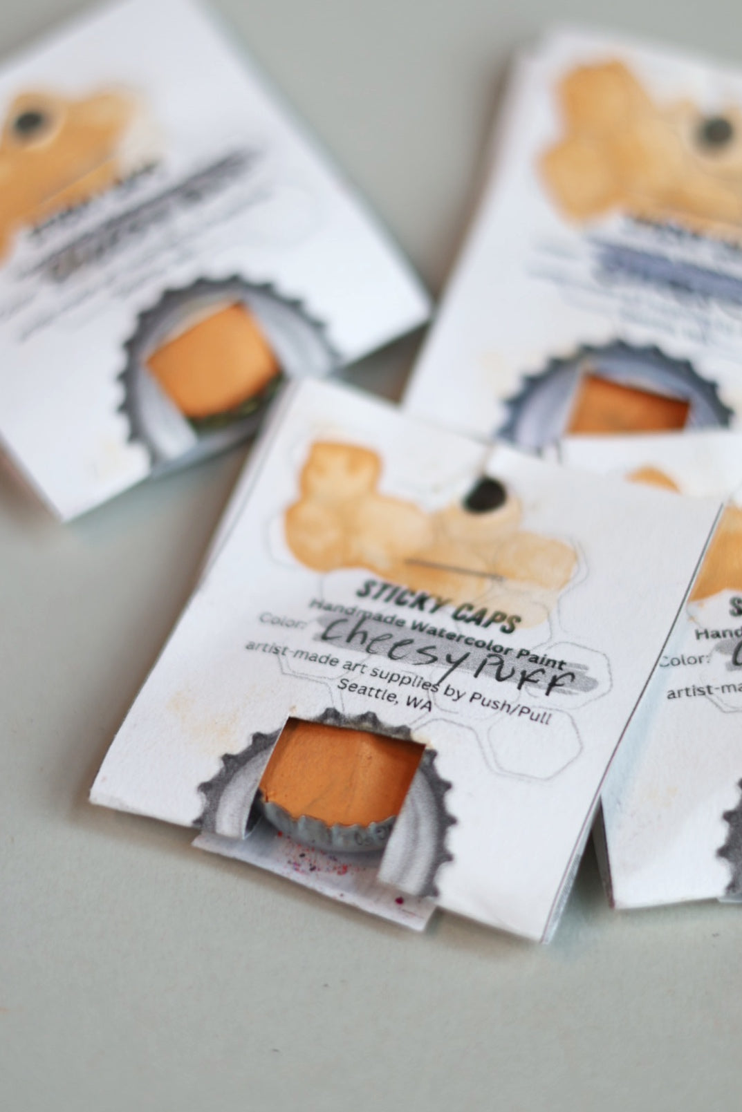 Watercolor Sticky Cap - Cheesy Puff