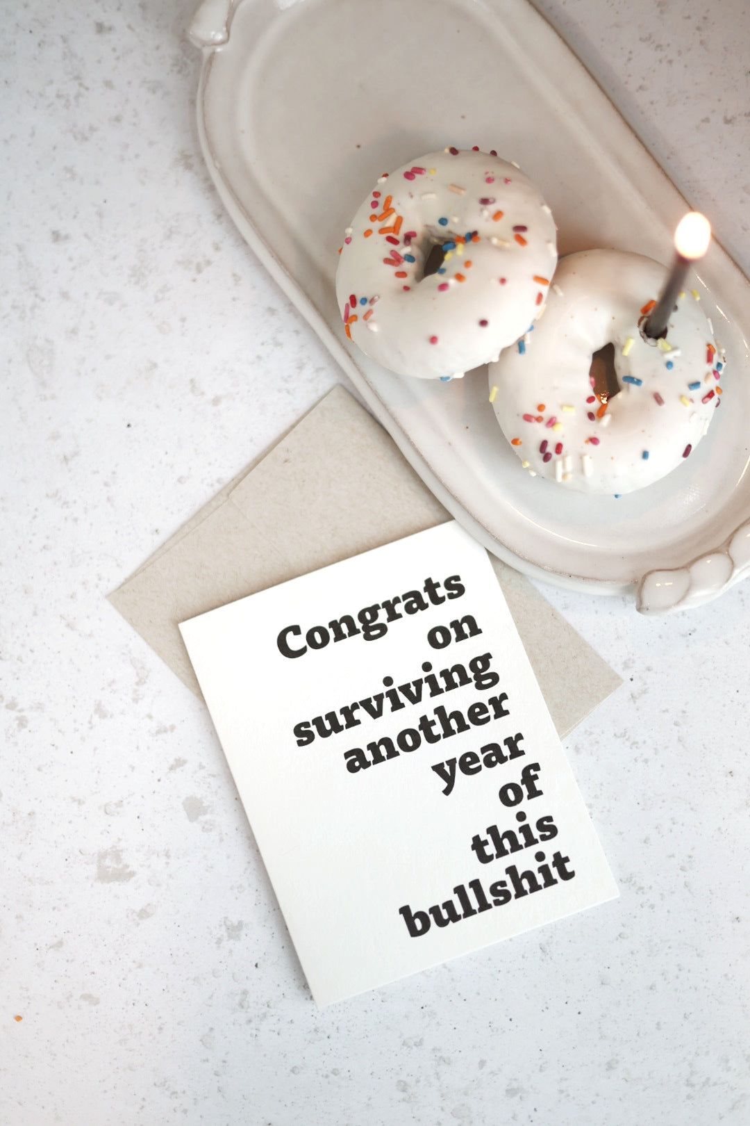 Congrats on surviving another year of this bullsh!t | Greeting card by Gravesco