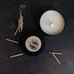 Pure soy Candle with matches on a dark surface
