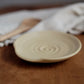 Ceramic plate on a wooden surface with a blurred background