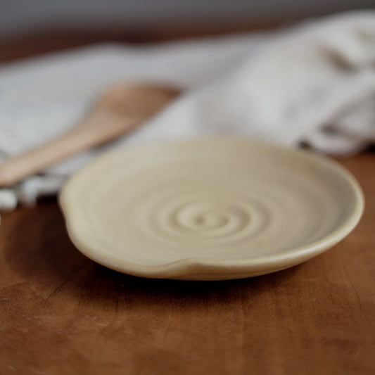Ceramic plate on a wooden surface with a blurred background