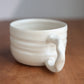 Cream latte mug on a wood surface