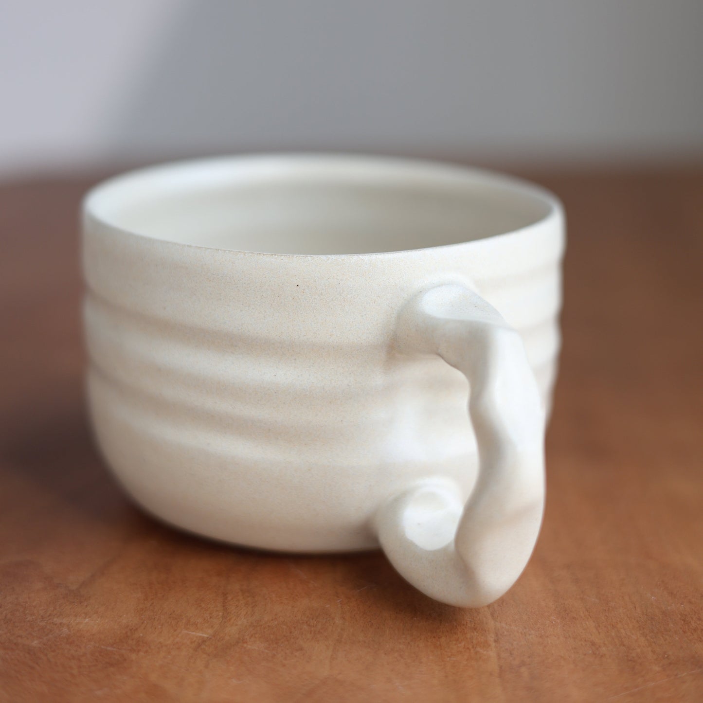 Cream latte mug on a wood surface