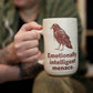 Person holding a mug with a raven design and text, blurred background