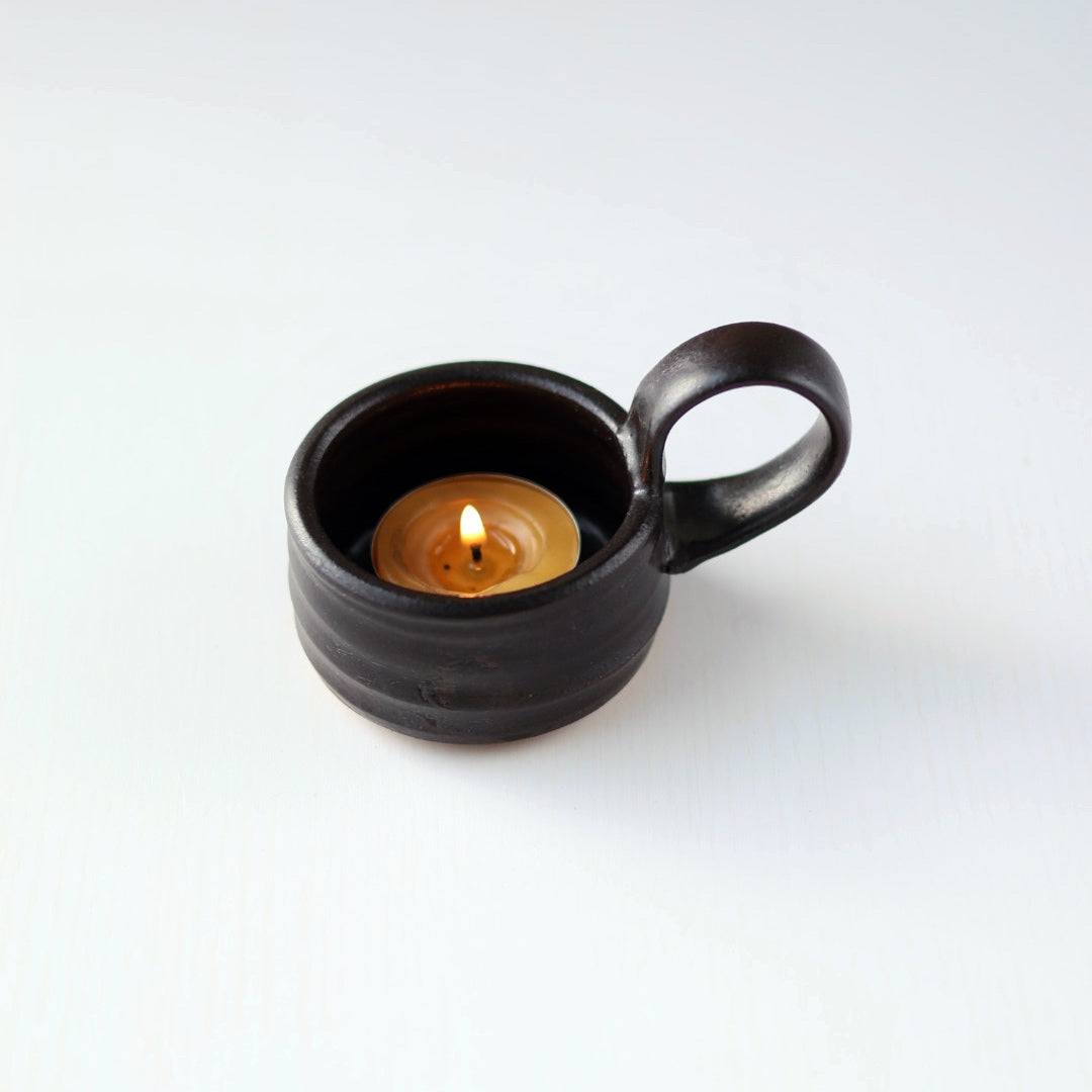 
                  
                    Tea Lite Candle Holder with Handle in Black
                  
                