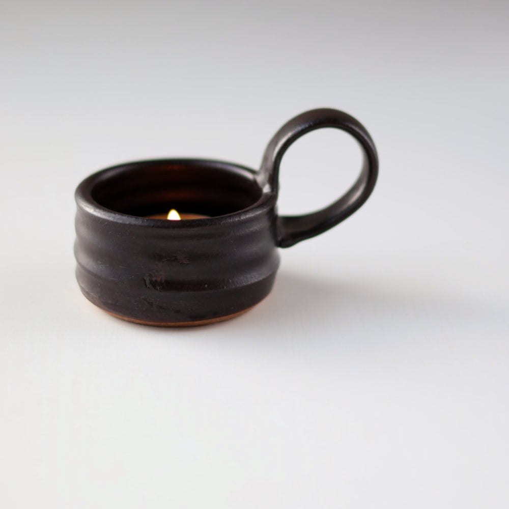 
                  
                    Tea Lite Candle Holder with Handle in Black
                  
                