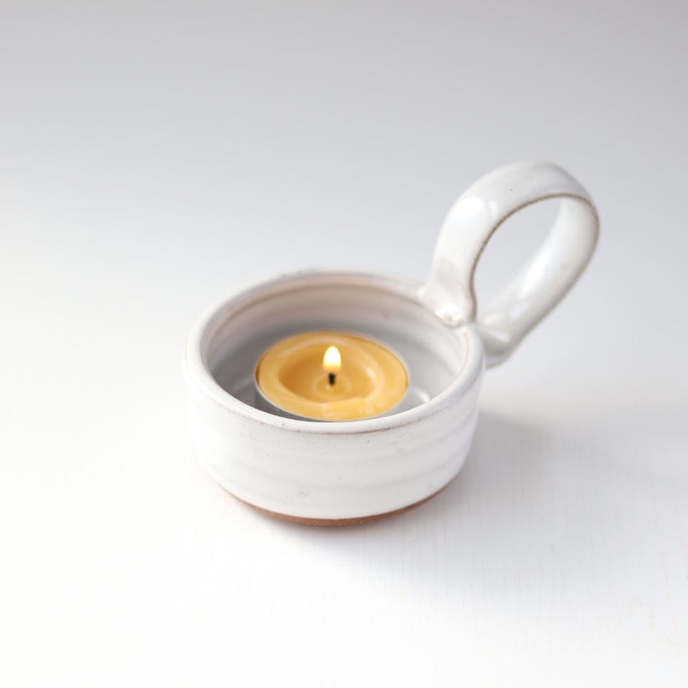 White ceramic candlestick holders with handle